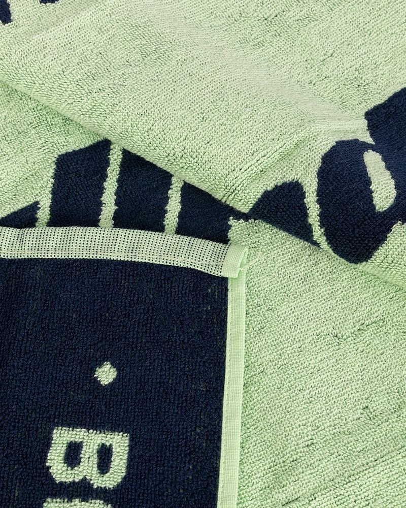 Detail van de stof van de Bullpadel BPTOWEL26 150x90 acid green handdoek